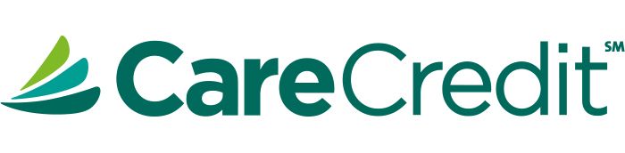 Logo of CareCredit featuring a green abstract leaf design next to the text.